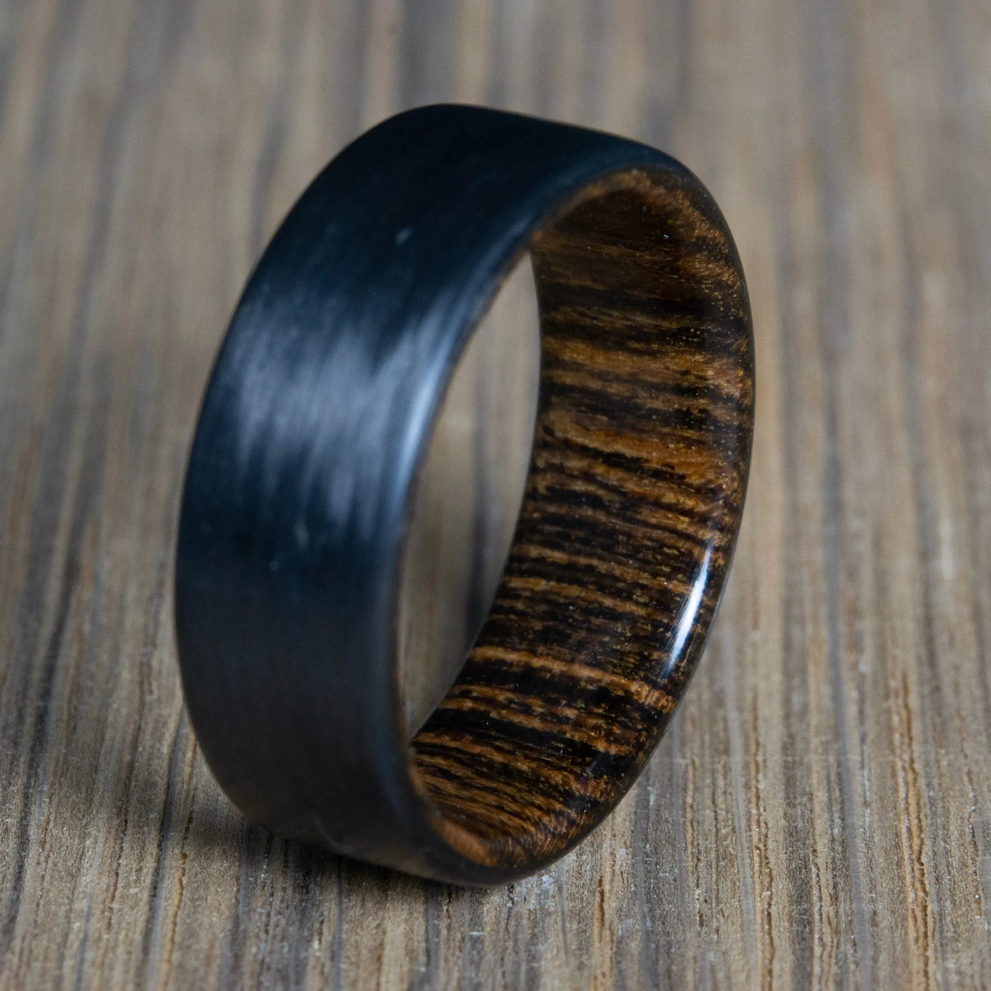 "Bocote" Carbon fiber men's wedding band with bocote wood interior